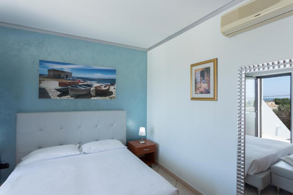 Postel nebo postele na pokoji v ubytování LI PALI Hotel & Restaurant