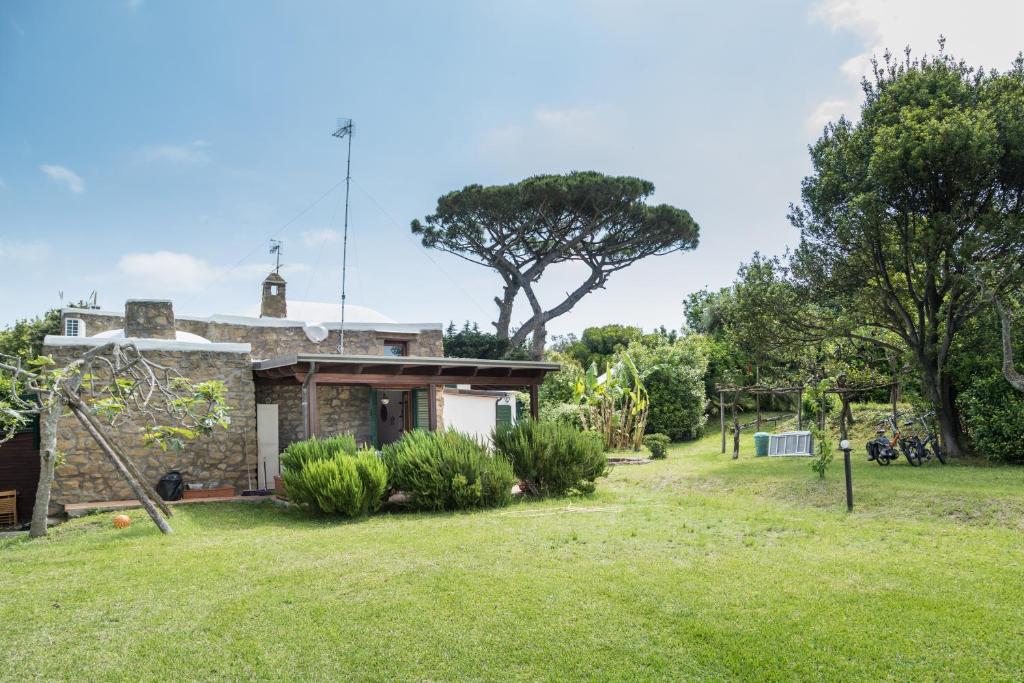 a house with a yard in front of it at TRE PINI in Procida