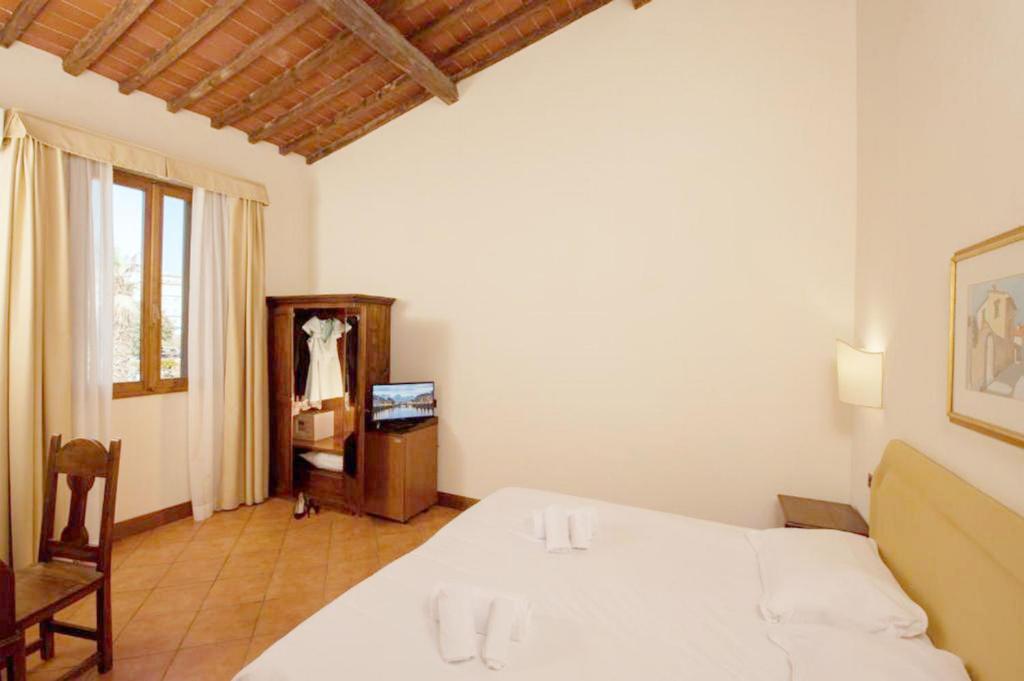 Postel nebo postele na pokoji v ubytování Hotel Relais Il Cestello
