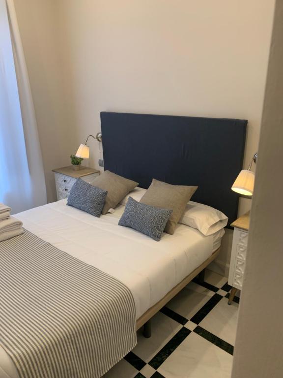 Postel nebo postele na pokoji v ubytování Hotel La Muralla