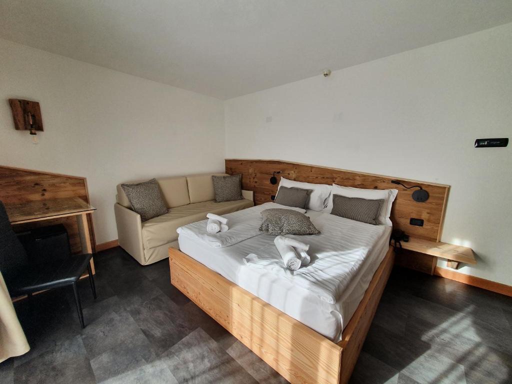 Postel nebo postele na pokoji v ubytování Hotel Pezzotti