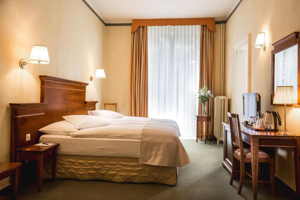 Letto o letti in una camera di Hotel Reine Victoria