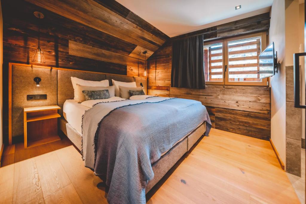 מיטה או מיטות בחדר ב-Boutique Hotel und Chalets Bergwiesenglück