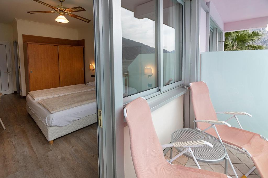 Posteľ alebo postele v izbe v ubytovaní Hotel Ideal