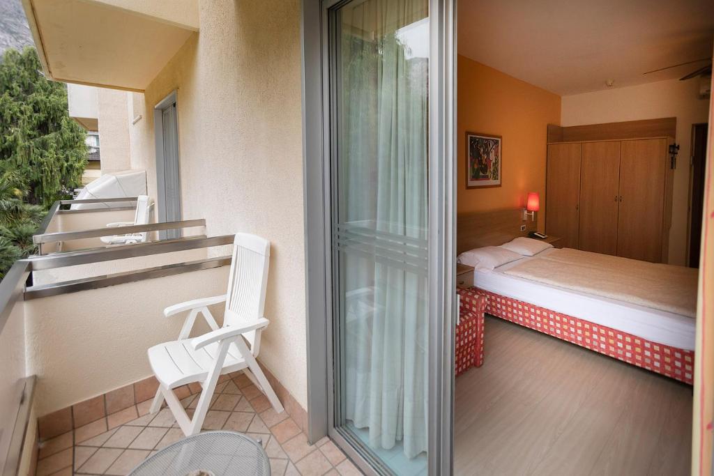 Posteľ alebo postele v izbe v ubytovaní Hotel Ideal