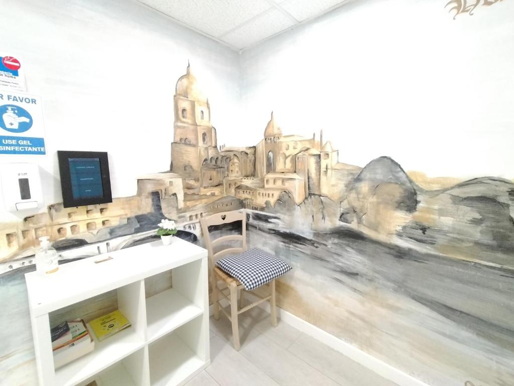 Una televisión o centro de entretenimiento en Hostal Albero by gaiarooms