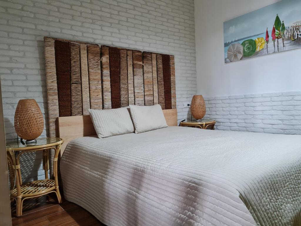 Postel nebo postele na pokoji v ubytování L'ISOLA AeR B&B