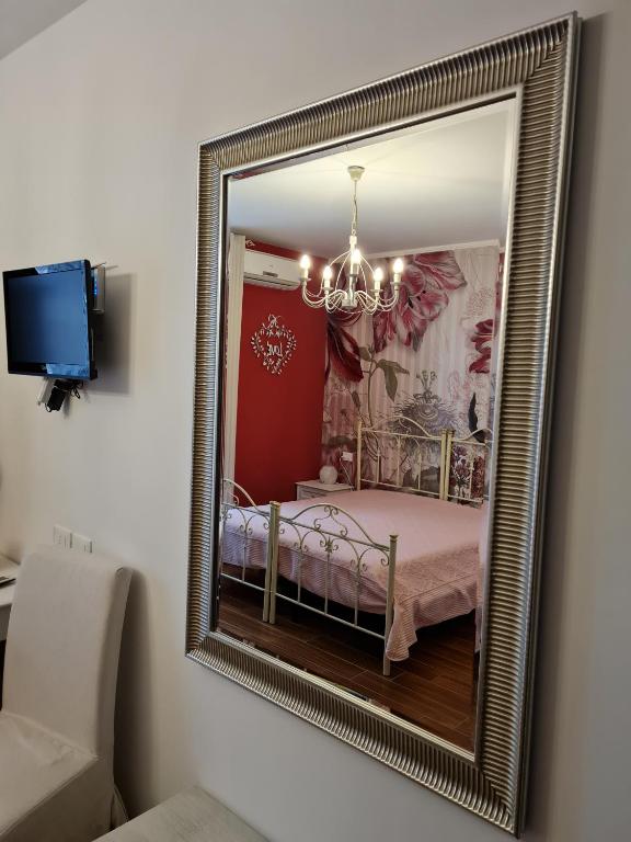 Postel nebo postele na pokoji v ubytování L'ISOLA AeR B&B