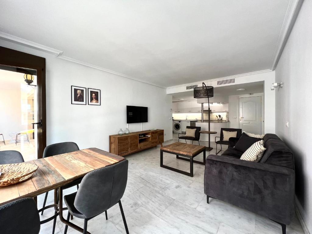 A television and/or entertainment centre at Bear Holiday - Apartment Maria in Moraira near the Beach