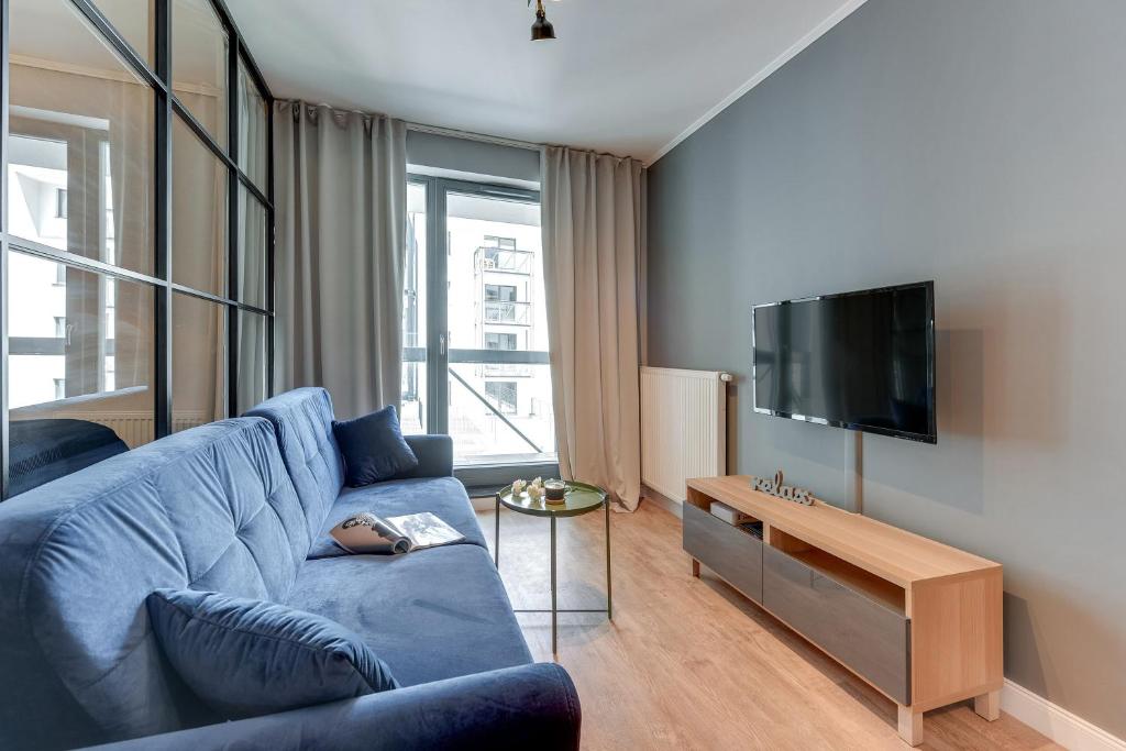 Televízia a/alebo spoločenská miestnosť v ubytovaní Browar Gdański Free Parking by Noclegi Renters