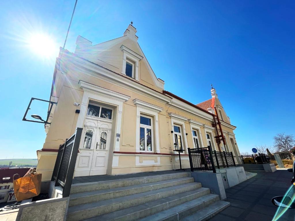 a building with stairs in front of it at Penzion Nad Lávkou in Uherský Brod