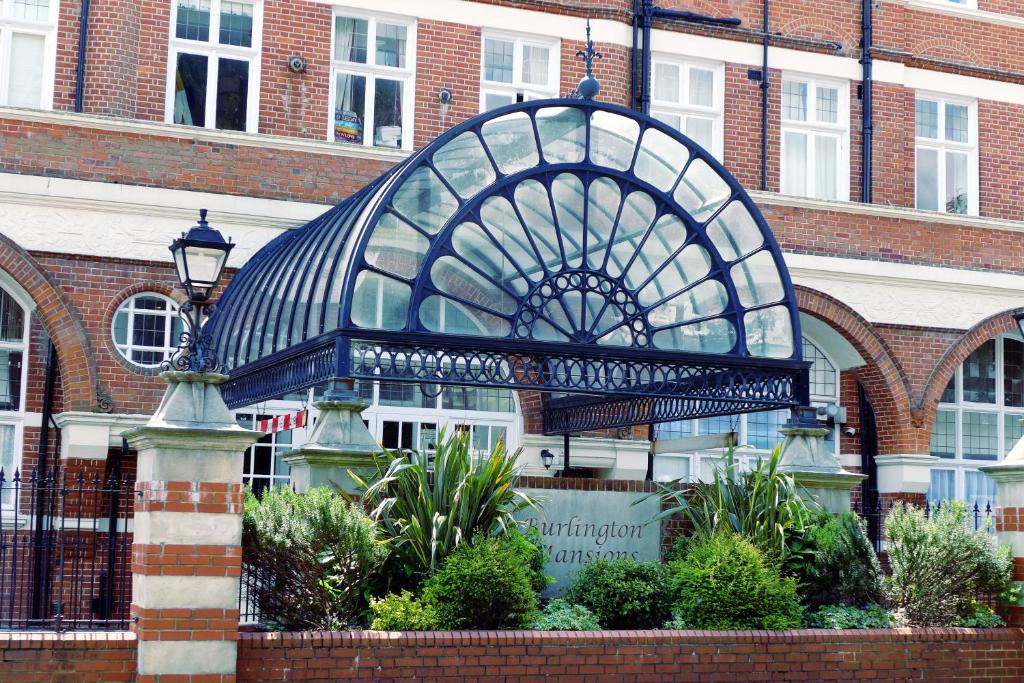 a building with a glass dome in front of it at Bournemouth Reef Apartment in Bournemouth