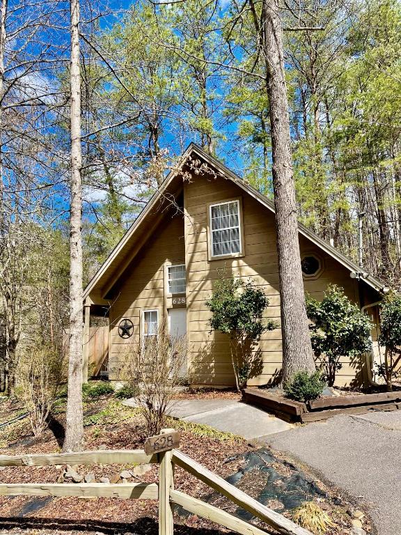 a house with a fence in front of it at Beary Charming Hottub Great Location 4 Miles to Gatlinburg in Gatlinburg
