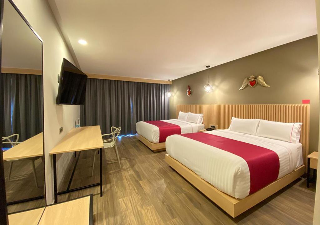 Postel nebo postele na pokoji v ubytování Hotel MX más san miguel de allende