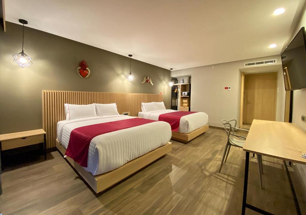 Postel nebo postele na pokoji v ubytování Hotel MX más san miguel de allende