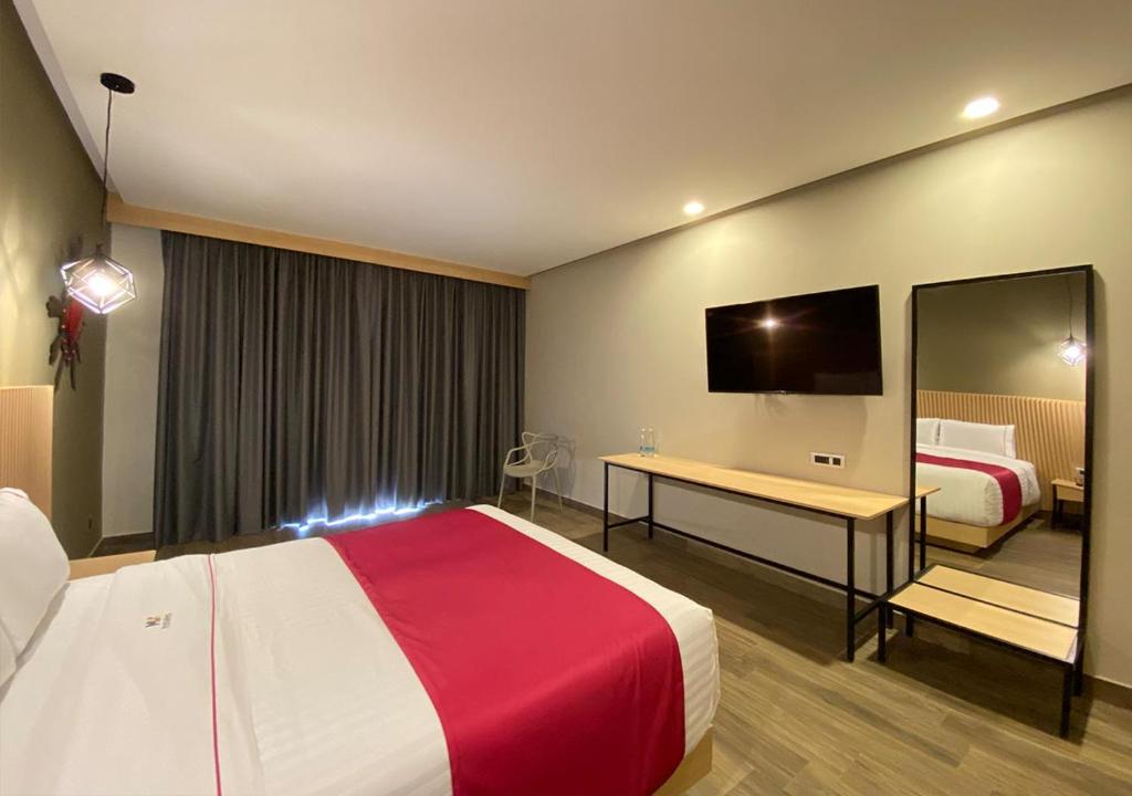 Postel nebo postele na pokoji v ubytování Hotel MX más san miguel de allende