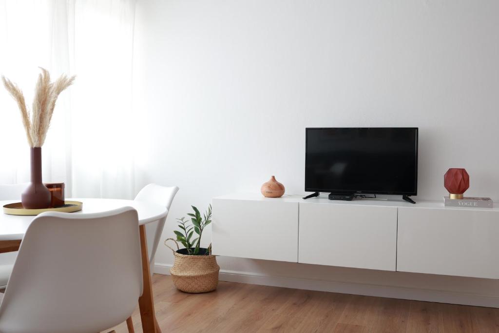 Televízia a/alebo spoločenská miestnosť v ubytovaní Apartment Pampas