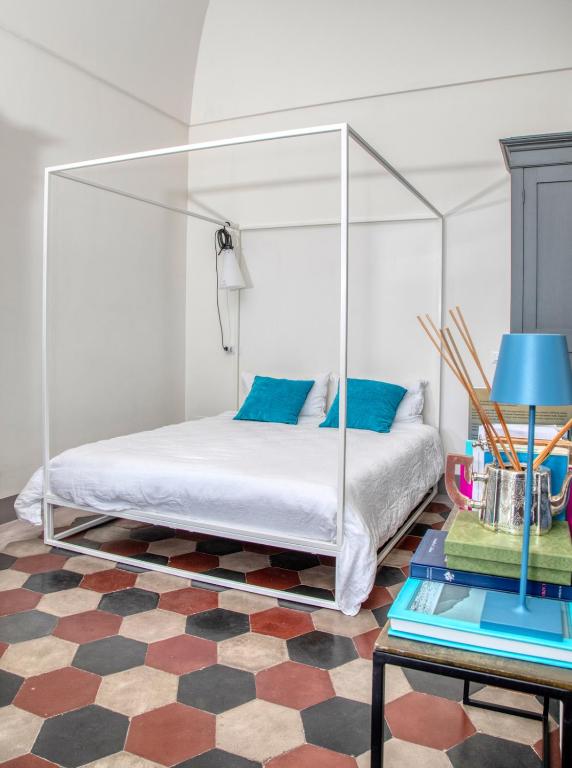 Łóżko lub łóżka w pokoju w obiekcie Casa Cantasol - Capri