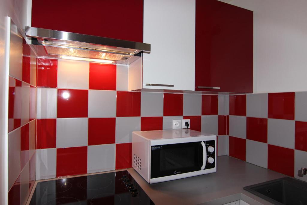 Kuchyň nebo kuchyňský kout v ubytování Olympic Appartements VTI