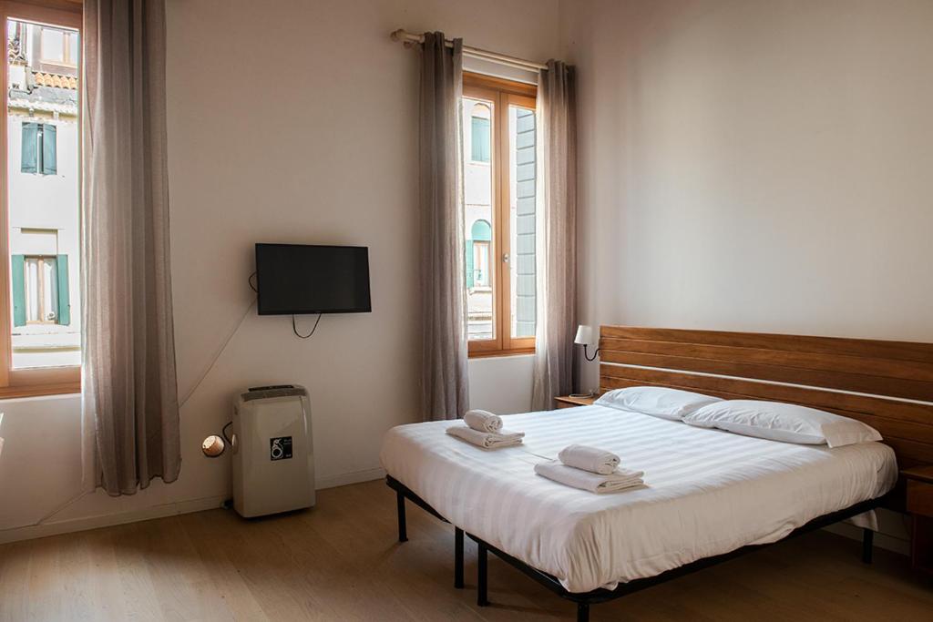 Postel nebo postele na pokoji v ubytování Allo Squero