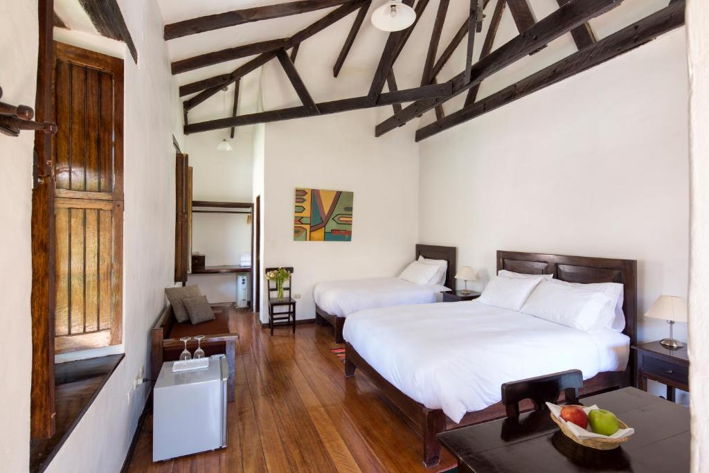 Postel nebo postele na pokoji v ubytování El Albergue Ollantaytambo