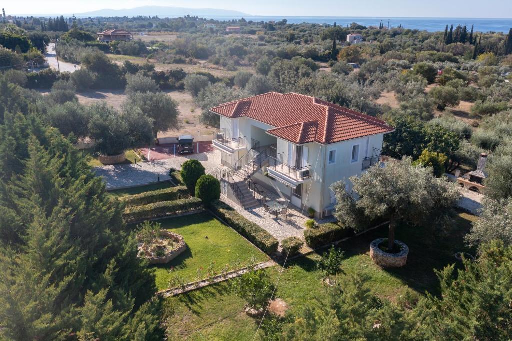an aerial view of a house with a yard at Vista Verde, Svoronata 2 Bedroom Apartment in Svoronata