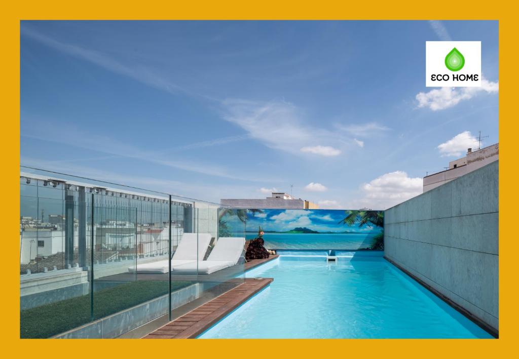 a swimming pool on the roof of a building at Green Living in Style - An Exclusive Designer Home near Galiana Golf in Carcagente