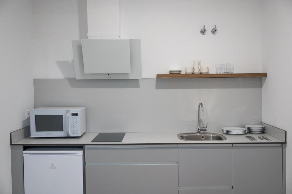 Kuchyň nebo kuchyňský kout v ubytování PALACIO REAL HOSTEL