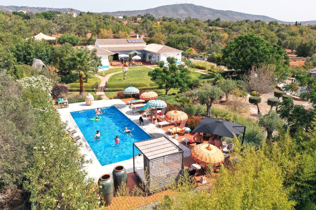 an aerial view of a pool at a resort at Seeds of Silence boutique wellbeing hotel near Olhao Faro in Olhão