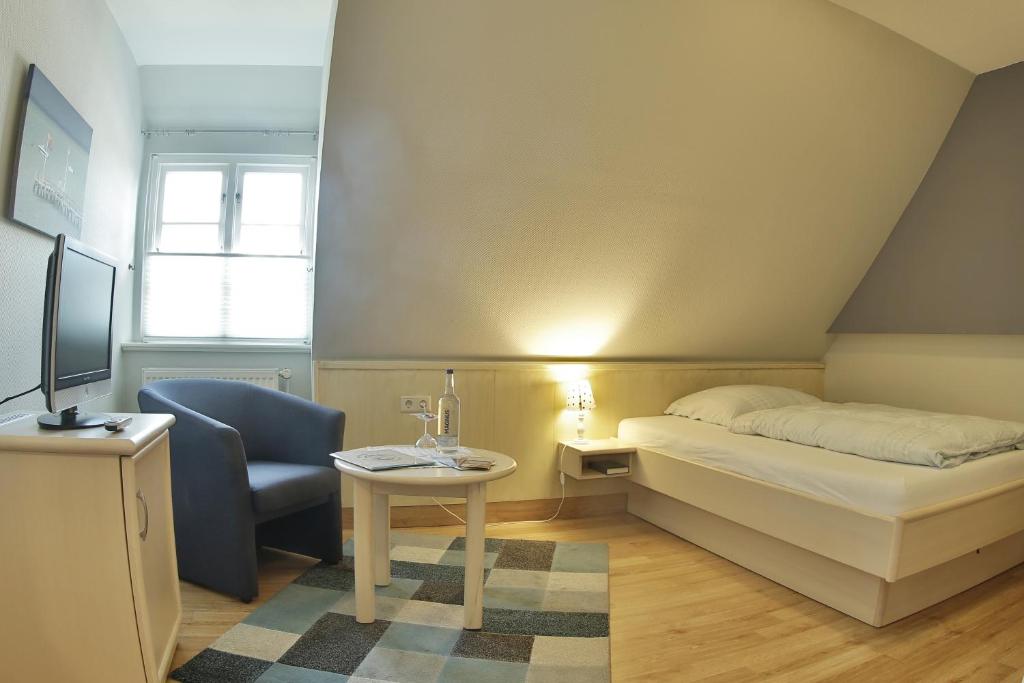 Postel nebo postele na pokoji v ubytování Gasthaus Knudsen