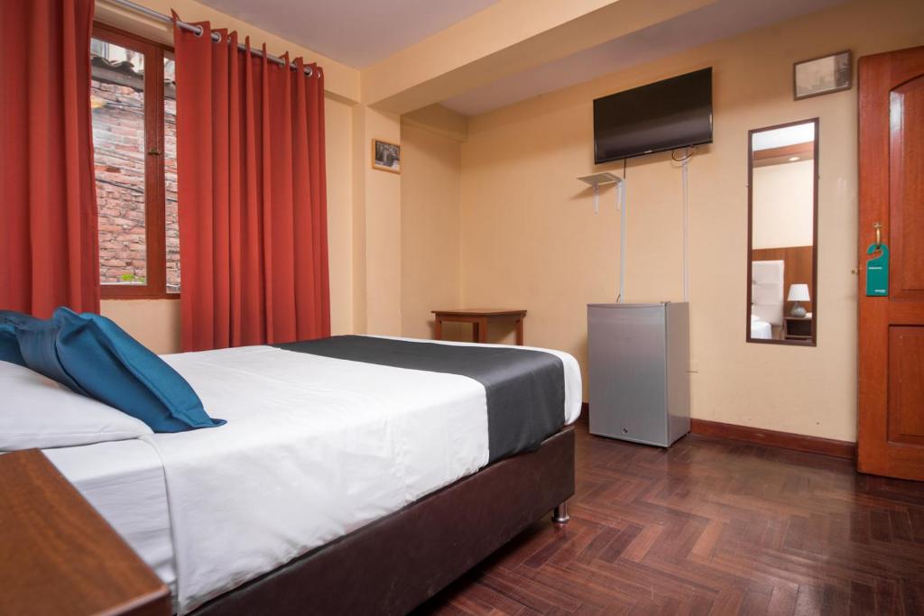 Uma cama ou camas num quarto em Ayenda Posada Inn