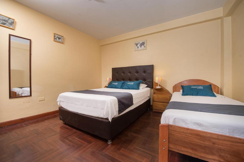 Uma cama ou camas num quarto em Ayenda Posada Inn