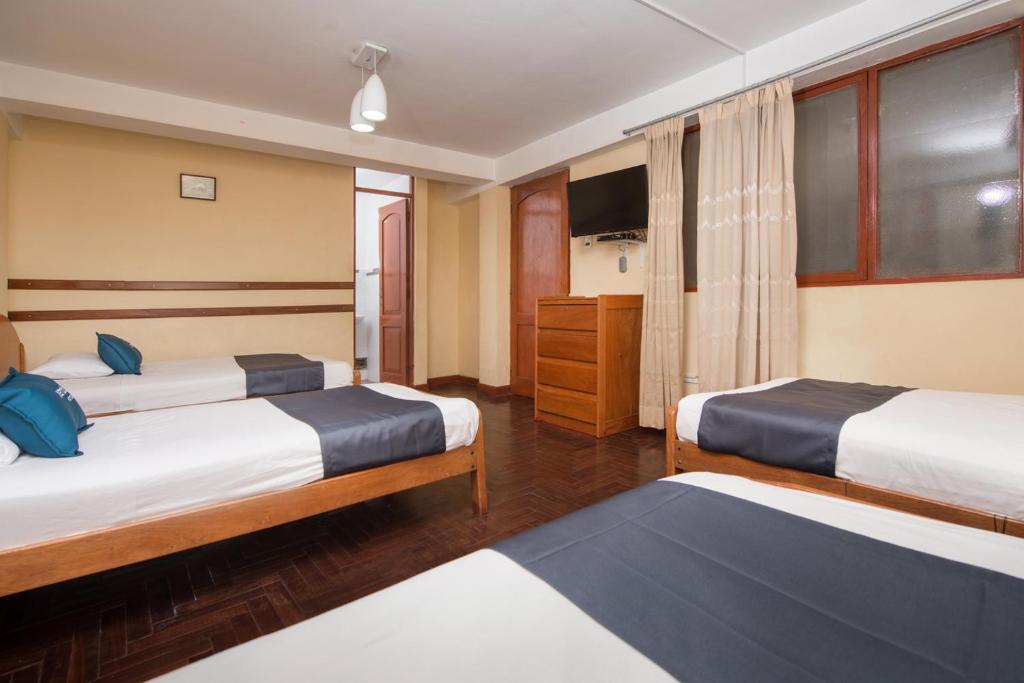 Uma cama ou camas num quarto em Ayenda Posada Inn