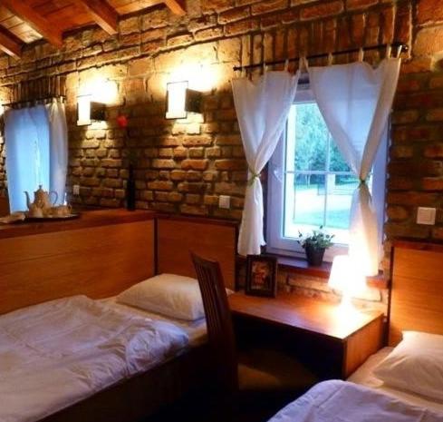 Postel nebo postele na pokoji v ubytování Trzy Dęby