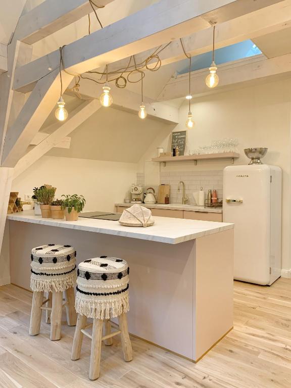 Kuchyň nebo kuchyňský kout v ubytování SOLEY - Stylische Ferienwohnung idyllisch gelegen