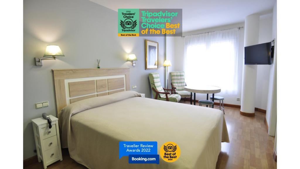 Llit o llits en una habitació de Hotel Apartamentos Aralso