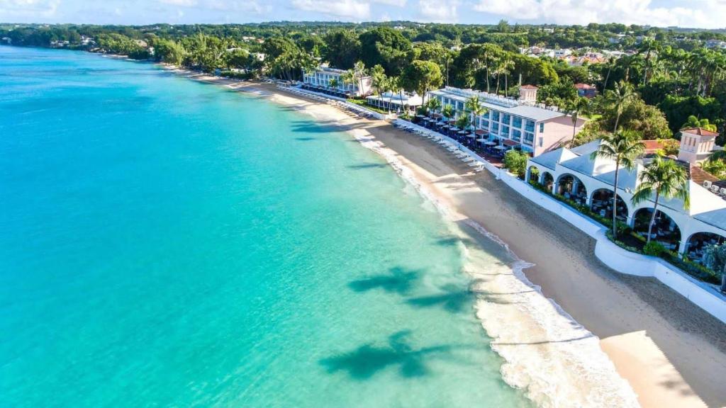 an aerial view of a beach and buildings at Fairmont Royal Pavilion Barbados Resort in Saint James