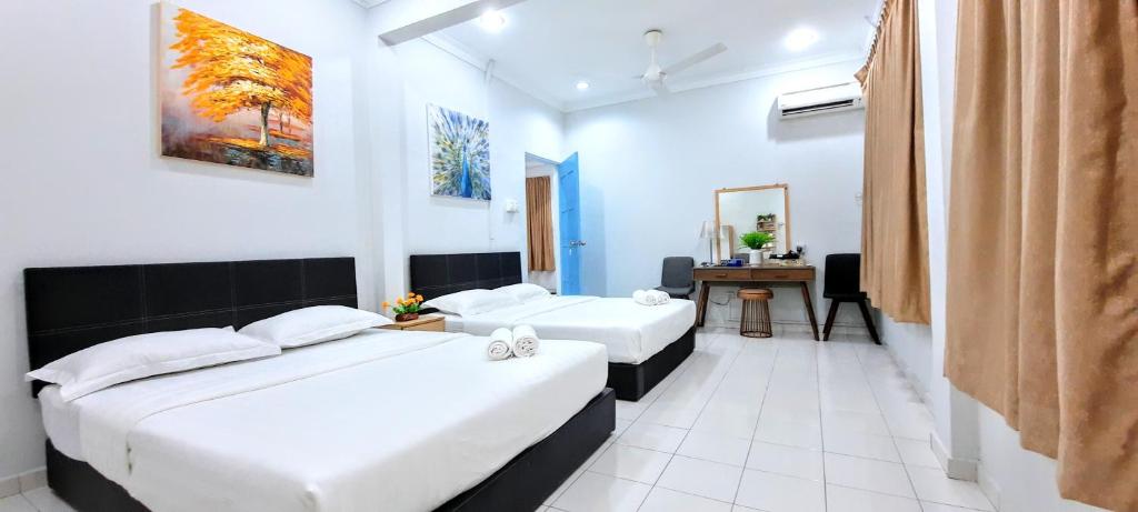 Postel nebo postele na pokoji v ubytování Kota Kinabalu Sabah City Homestay