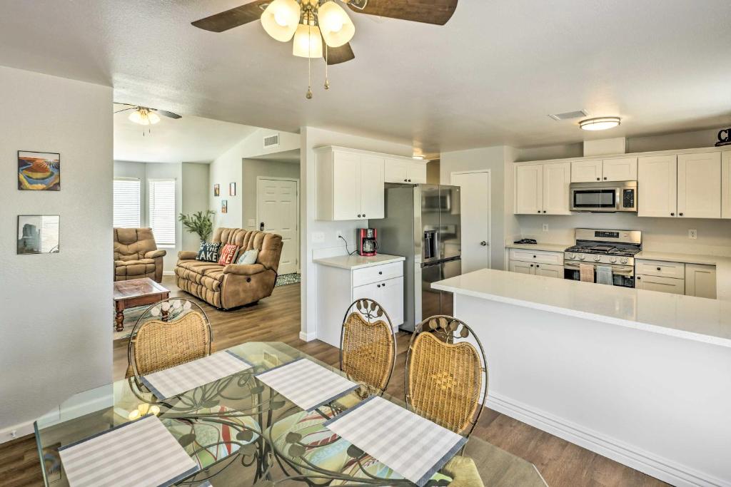 a kitchen and living room with a table and chairs at Bullhead City Home, Steps to Colorado River! in Bullhead City