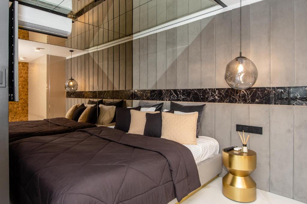Posteľ alebo postele v izbe v ubytovaní Super-Apartamenty VIP Jacuzzi II