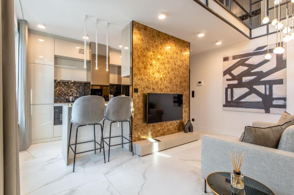 Televízia a/alebo spoločenská miestnosť v ubytovaní Super-Apartamenty VIP Jacuzzi II
