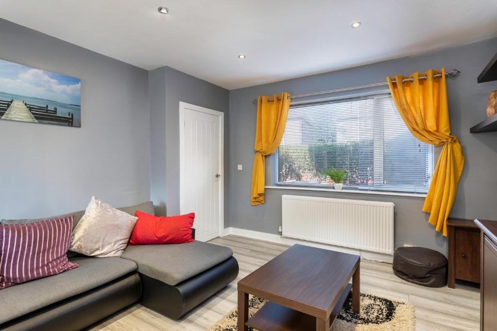 a living room with a couch and a table at Annandale House Hartlepool in Hartlepool