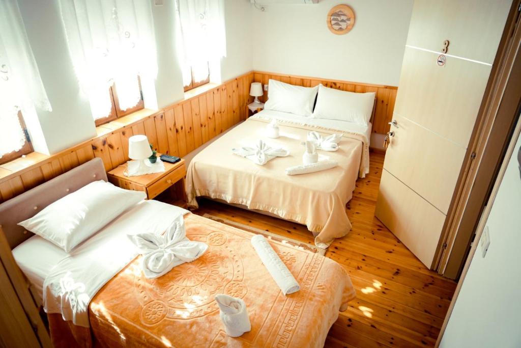 Postel nebo postele na pokoji v ubytování Hotel Domino