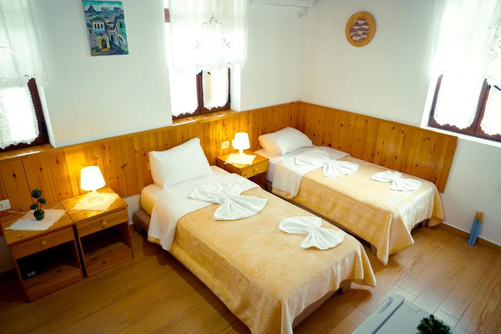 Postel nebo postele na pokoji v ubytování Hotel Domino
