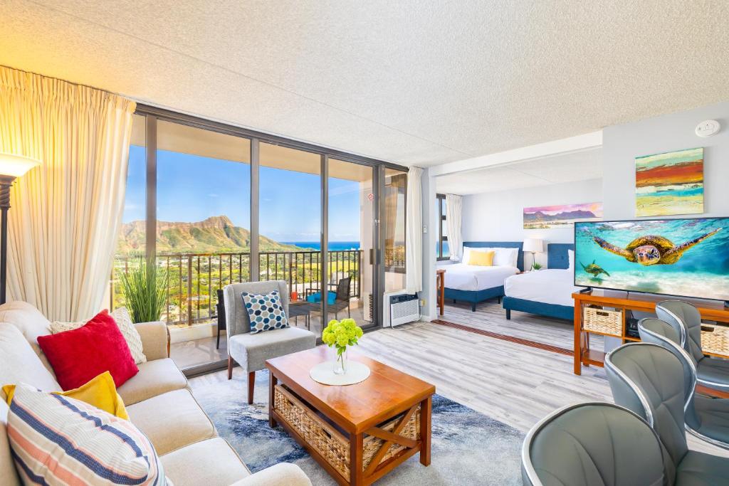 a living room with a view of the ocean at Ocean & Diamond Head Views - Near Beach - Parking! in Honolulu