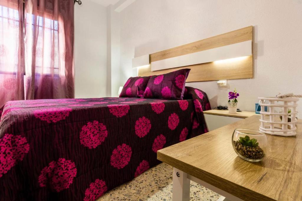 En eller flere senge i et værelse på APARTAMENTO CAREY