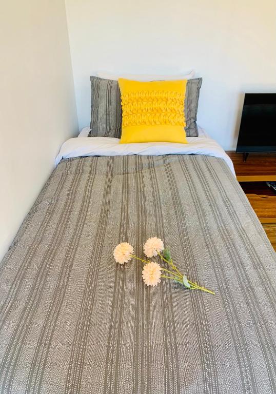 Postel nebo postele na pokoji v ubytování Auckland Central Motel