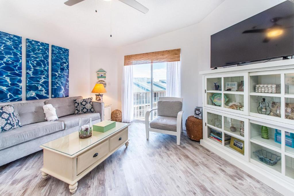 a living room with a couch and a table at Gulfview II 301 in Destin