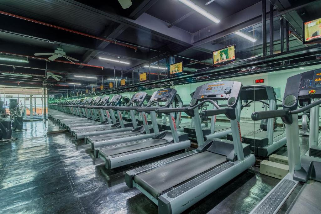 a row of tread machines in a gym at Camino Real Aeropuerto in Mexico City
