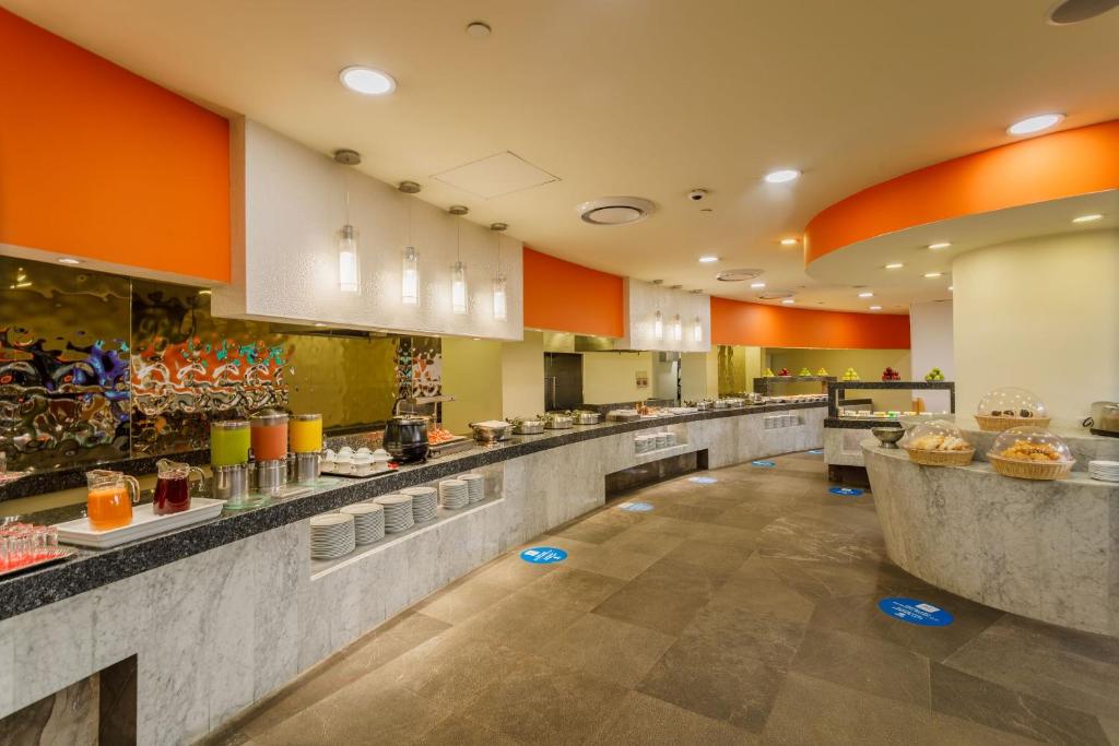 a large kitchen with a long line of counters at Camino Real Aeropuerto in Mexico City